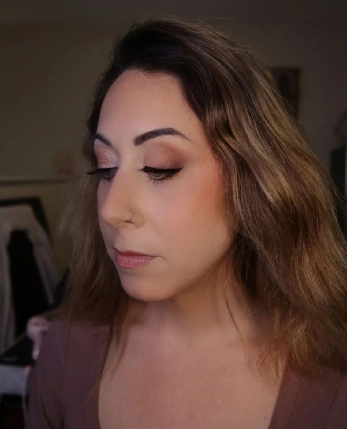 Client with a soft, neutral makeup look