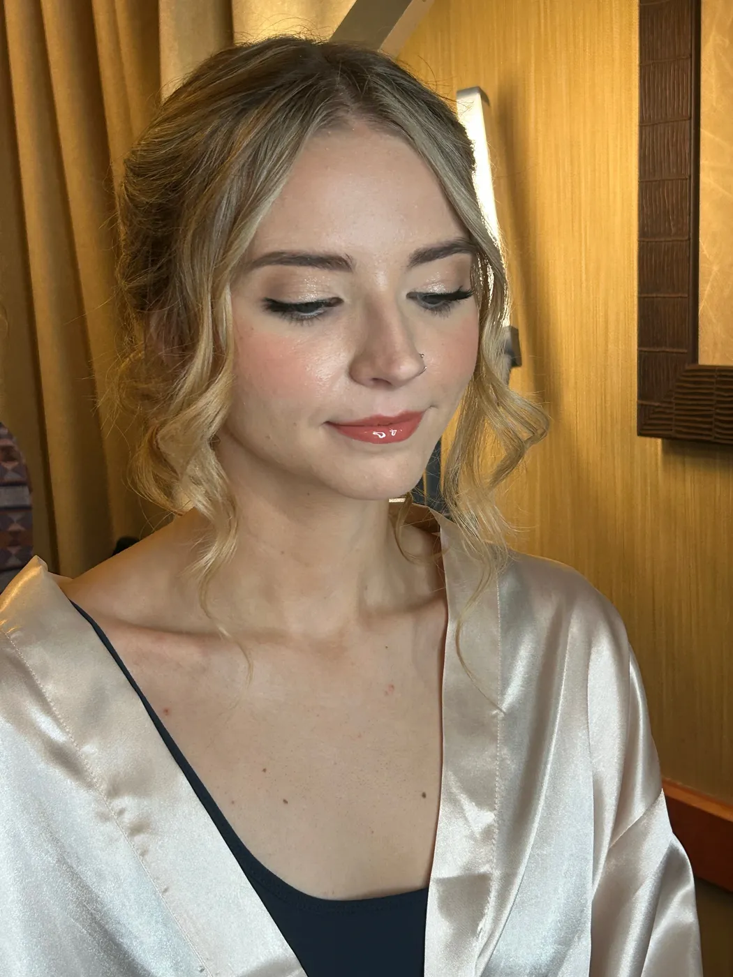 Bridesmaid with a polished makeup look