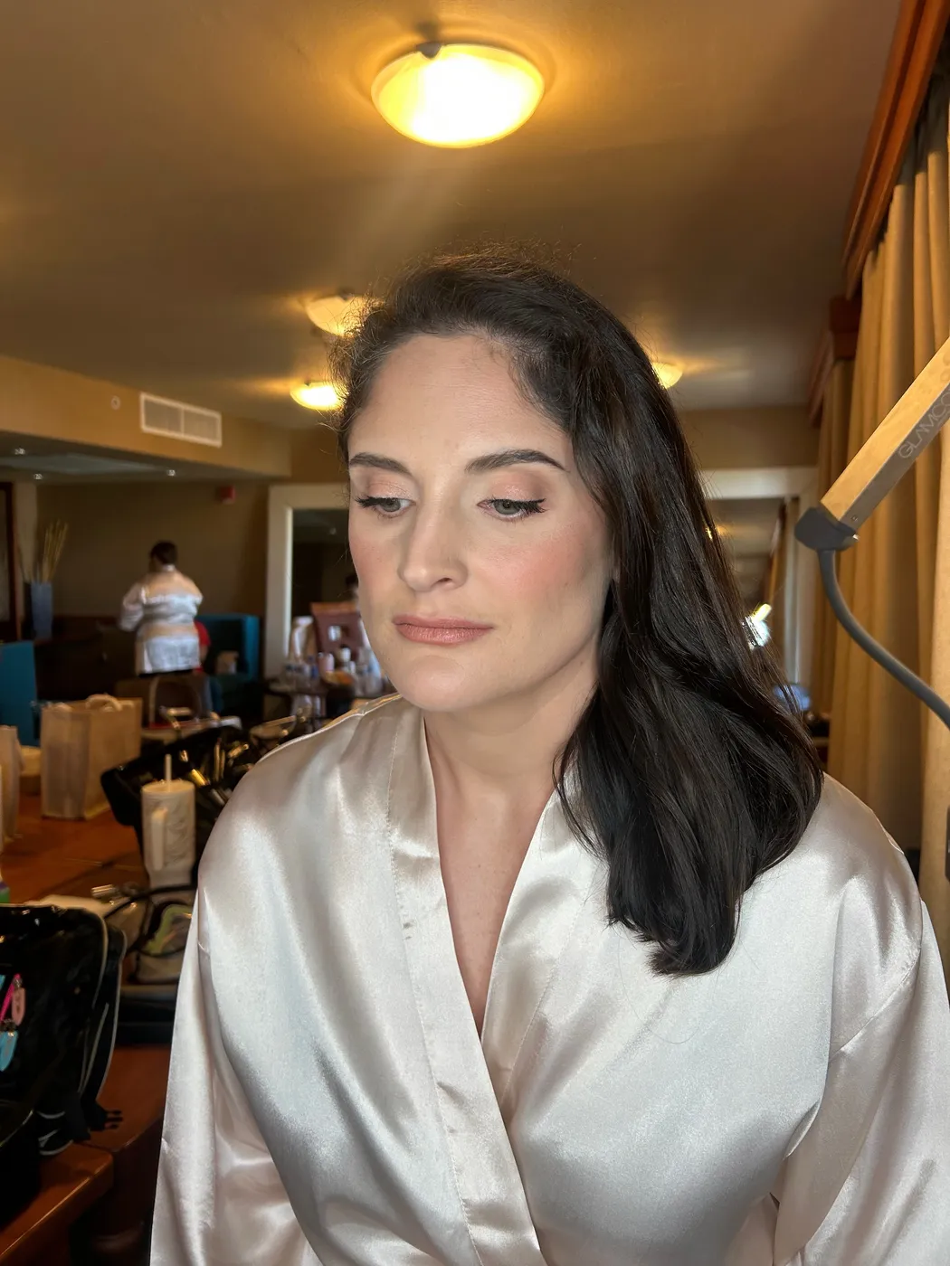 Bridesmaid makeup application in progress
