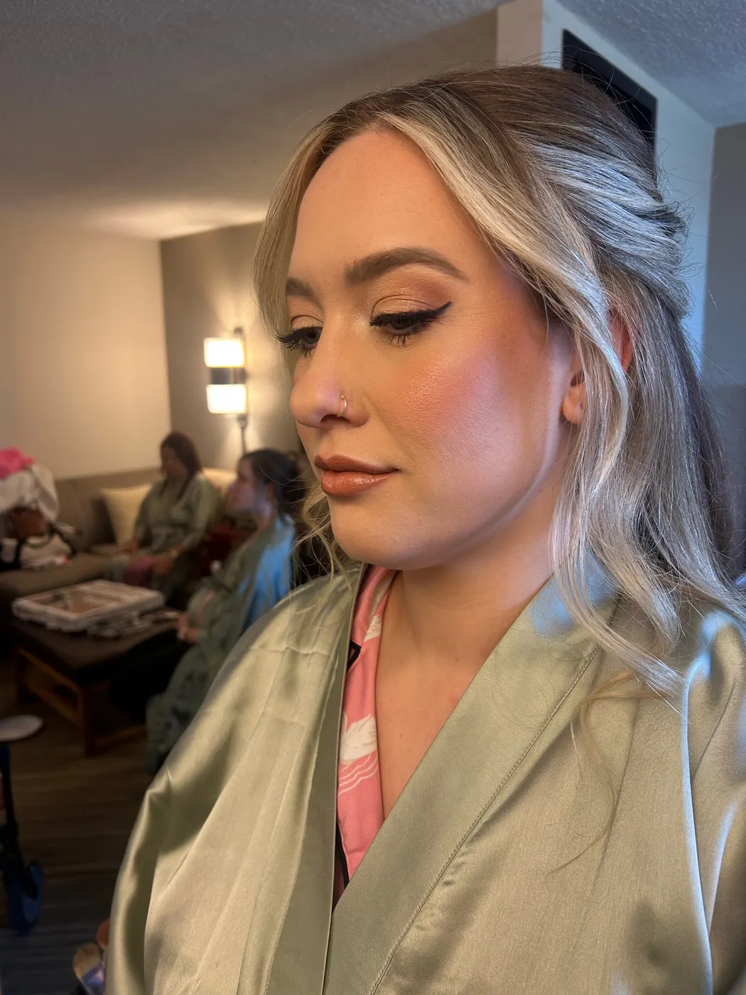 Client with a winged eyeliner makeup look